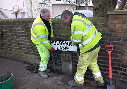 Workmen removing the old Mulberry Lane Sign